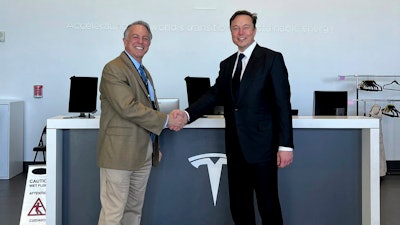 This photo provided by the Nevada Governor's Office shows Nevada Gov. Joe Lombardo, left, with Elon Musk on Tuesday, Jan. 24, 2023 at the Tesla Gigafactory at the Truckee-Reno Industrial Center east of Sparks, Nev.