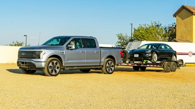 This photo provided by Edmunds shows the 2022 Ford Lightning electric pickup truck. It is capable of towing up to 10,000 pounds, though towing will significantly affect its range.