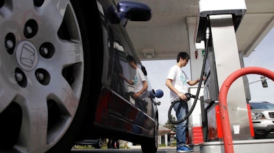 A motorist fuels up at a gas station in Santa Cruz, Calif., Monday, March 7, 2011. A leak in a fuel pipeline facility in California has forced a shutdown of deliveries of gasoline and diesel from the Los Angeles to areas including Las Vegas and Phoenix.