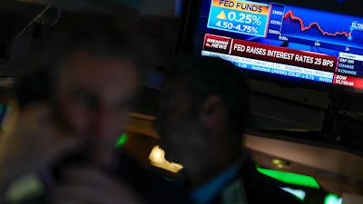 The Federal Reserve interest rate announcement displayed on the floor of the New York Stock Exchange, Feb. 1, 2023.