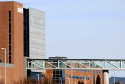 Workers walk on a skybridge to and from a large Intel facility in Hillsboro, Ore., on March 17, 2023.