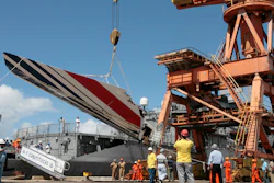 Workers unloading debris, belonging to crashed Air France flight AF447, from the Brazilian Navy's Constitution Frigate in the port of Recife, northeast of Brazil, Sunday, June 14, 2009. A French court is ruling Monday April 17, 2023 on whether Airbus and Air France are guilty of manslaughter over the 2009 crash of Flight 447 en route from Rio to Paris, which killed 228 people and led to lasting changes in aircraft safety measures.