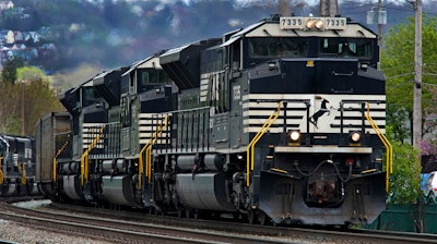 A Norfolk Southern freight train makes it way through Homestead, Pa., April 27, 2022.