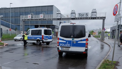 Police emergency vehicles are parked at a Mercedes-Benz plant in Sindelfingen, Germany, Thursday May 11, 2023.