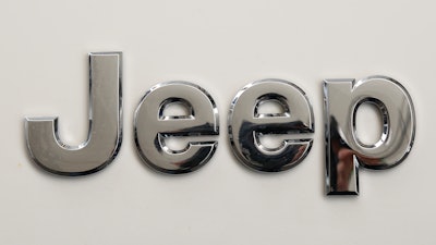 This is the Jeep logo on the front end of a Jeep Cherokee on display at the Pittsburgh International Auto Show in Pittsburgh Thursday, Feb. 11, 2016.