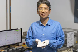 Jun Qu of ORNL shows stainless-steel disks before (silver) and after (black) coating with carbon nanotubes that provide superlubricity.