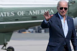 President Joe Biden waves as he walks to board Air Force One at Dover Air Force Base, Del., Monday, June 19, 2023, as he heads to California.