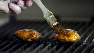 Chef Zach Tyndall prepares Good Meat's cultivated chicken at the Eat Just office in Alameda, Calif., Wednesday, June 14, 2023.