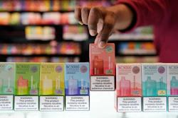 An employee displays some of the varieties of disposable electronic cigarette devices manufactured by EB Design, formerly known as Elf Bar, at Vapes N Smoke in Pinecrest, Fla., Monday, June 26, 2023.