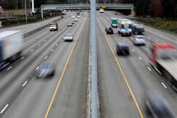 Cars and trucks travel on Interstate 5 near Olympia, Wash., March 25, 2019. The government’s traffic safety agency said Thursday, June 22, 2023, that it will require heavy trucks and buses to include potentially life-saving automatic emergency braking equipment within five years. Automatic braking systems in heavy vehicles would prevent nearly 20,000 crashes a year and save at least 155 lives, the National Highway Traffic Safety Administration said.
