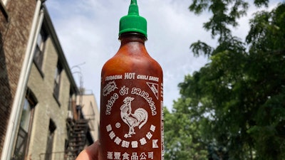 A bottle of Sriracha chili sauce shown in New York, July 13, 2023.