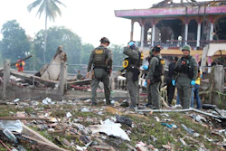 Thai Explosive Ordnance Disposal (EOD) personnel examine the site of an explosion at a firework warehouse in Narathiwat province southern Thailand, Saturday, July 29, 2023.