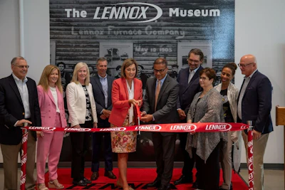 The Lennox Board of Directors, joined by CEO Alok Maskara, and Iowa Governor Kim Reynolds (center), ceremoniously cut the ribbon to inaugurate the newly renovated facility in Marshalltown, Iowa, on Thursday July 13, 2023.