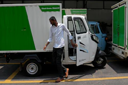 An electric rickshaw delivery driver exits after parking the vehicle at logistics company City Link in Bengaluru, India, Wednesday, May 31, 2023.