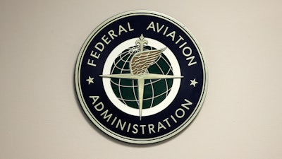 A Federal Aviation Administration sign hangs in the tower at John F. Kennedy International Airport in New York, March 16, 2017.