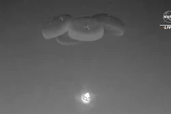 In this image from video made available by NASA, a SpaceX capsule, slowed by parachutes, approaches the surface of the Atlantic Ocean off the Florida coast, Monday, Sept. 4, 2023, as it returns to Earth with NASA astronaut Stephen Bowen, United Arab Emirates astronaut Sultan al-Neyadi, NASA astronaut Warren (Woody) Hoburg and Roscosmos cosmonaut Andrei Fedyaev after a six-month stay at the International Space Station.