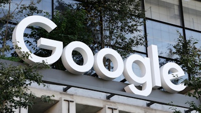 The Google sign is shown over an entrance to the company's new building in New York on Wednesday, Sept. 6, 2023.