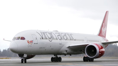 A Virgin Atlantic Boeing 787-9 passenger airplane arrives following a flight from London to Seattle, March 27, 2017, at Seattle-Tacoma International Airport in Seattle. The first commercial airliner to cross the Atlantic on a purely high-fat, low-emissions diet flew Tuesday Nov. 28, 2023 from London to New York in a step toward achieving what supporters dubbed as “jet zero.'