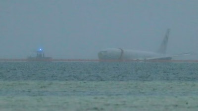 A downed U.S. Navy aircraft is seen in Kaneohe Bay, Monday, Nov. 20, 2023, in Kaneohe, Hawaii.