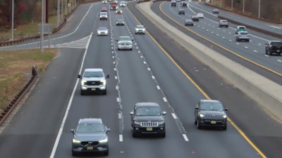 Cars drive on the Garden State Parkway in Brick, N.J. on Tuesday, Nov. 21, 2023, the same day that New Jersey officials said they will move to end the sale of new gasoline-powered vehicles in the state by 2035.