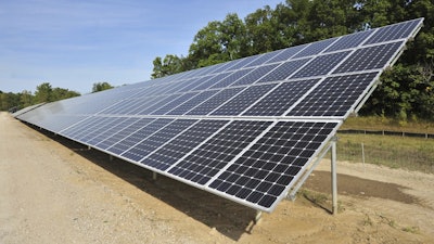One of more than 4,000 solar panels constructed by DTE Energy lines a 9.37-acre swath of land in Ann Arbor Township, Mich., Sept. 15, 2015.