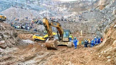 Excavators and people surround the scene of the miners rescue operation on Sunday, Dec. 3, 2023 in Chingola, around 400 kilometers (248 miles) north of the capital Lusaka, Zambia.