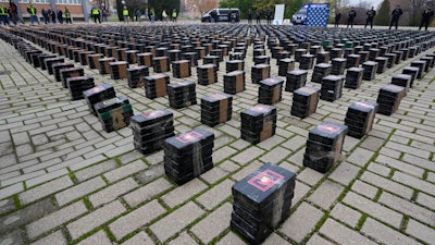 Part of a haul of 11 tons of cocaine is displayed in the patio of a police station in Madrid, Spain, Tuesday, Dec. 12, 2023.