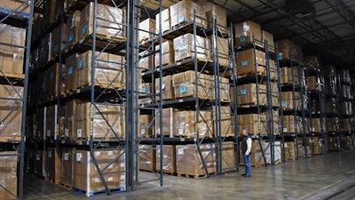 Boxes of personal protection equipment maintained by the Missouri Department of Health and Senior Services are shown stacked in a warehouse in Jefferson City, Mo., on Dec. 1, 2023.