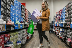 Ashley Crafton looks at tennis shoes at Shoe Stop in Wesleyan Park Plaza, Owensboro, Ky., Nov. 25, 2023.