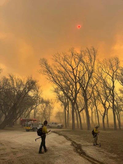 In this photo provided by the Flower Mound, Texas, Fire Department, Flower Mound firefighters respond to a fire in the Texas Panhandle, Tuesday, Feb. 27, 2024.