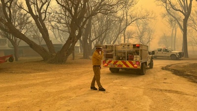 In this photo provided by the Flower Mound, Texas, Fire Department, Flower Mound firefighters respond to a fire in the Texas Panhandle, Tuesday, Feb. 27, 2024.