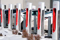 Motorists recharge their Tesla vehicles at a Tesla supercharging location, Jan. 16, 2024, in northeast Denver.