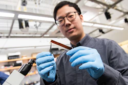 University of Chicago materials researcher Pengju Li holds a prototype pacemaker made of a specially engineered membrane.