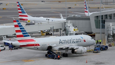 American Airlines planes sit on the tarmac at Terminal B at LaGuardia Airport, Jan. 11, 2023, in New York.
