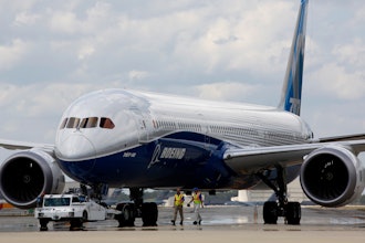 In this Friday, March 31, 2017, file photo, Boeing employees walk the new Boeing 787-10 Dreamliner down towards the delivery ramp area at the company's facility in South Carolina after conducting its first test flight at Charleston International Airport in North Charleston, S.C.