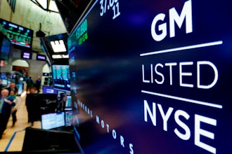 In this April 23, 2018, file photo, the logo for General Motors appears above a trading post on the floor of the New York Stock Exchange.