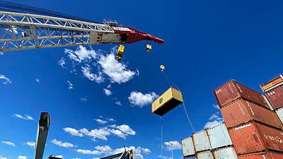 In this photo provided by the Key Bridge Response 2024 Unified Command, response crews begin removing shipping containers from the deck of the cargo ship Dali using a floating crane barge at the site of the Francis Scott Key Bridge, Sunday, April 7, 2024, in Baltimore.