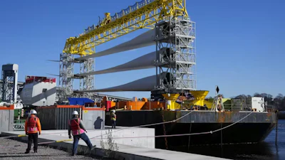 A generator and blades head for the South Fork Wind farm from New London, Conn., on Dec. 4, 2023.
