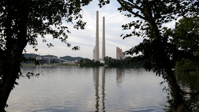 In this Aug. 7, 2019, photo, the Kingston Fossil Plant stands near a waterway in Kingston, Tenn.