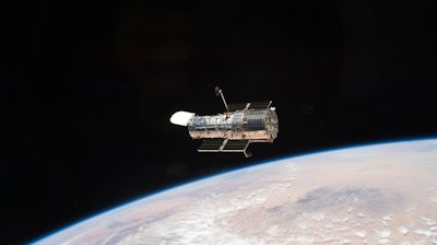 This photo provided by NASA, an STS-125 crew member aboard the Space Shuttle Atlantis captured this image of NASA’s Hubble Space Telescope on May 19, 2009.