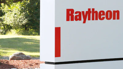 A sign stands at the road leading to the Raytheon facility in Marlborough, Mass., on June 10, 2019.