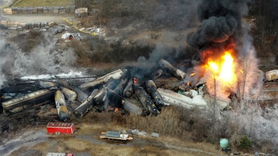 Portions of a Norfolk Southern freight train that derailed the night before burn in East Palestine, Ohio, Feb. 4, 2023.