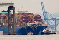Tugboats escort the cargo ship Dali after it was refloated in Baltimore, Monday, May 20, 2024.