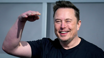 Tesla CEO Elon Musk waves as he leaves the Tesla Gigafactory for electric cars in Gruenheide near Berlin, Germany on March 13, 2024.