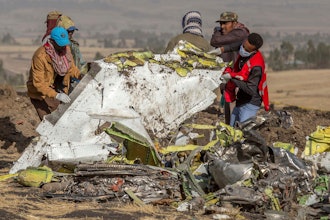 Workers recover debris at the scene of an Ethiopian Airlines Boeing Max plane crash on March 11, 2019, outside of Addis Ababa, Ethiopia.