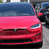 Unsold 2023 Model X sports-utility vehicles sit at a Tesla dealership, June 18, 2023, in Littleton, Colo.