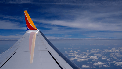 A Southwest Airlines Boeing 737 Max 8 passenger jet flies over the central United States heading for Chicago from Tulsa, Okla., June 15, 2024, in Tulsa.