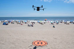 A drone lands for a battery swap at Rockaway Beach in New York.