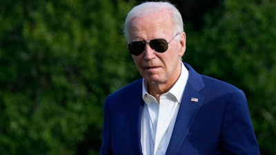 President Joe Biden walks across the South Lawn of the White House in Washington, Sunday, July 7, 2024, after returning from a trip to Pennsylvania.