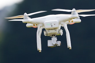 A DJI Phantom 3 drone flies during a drone demonstration at a farm and winery in Cordova, Md. China